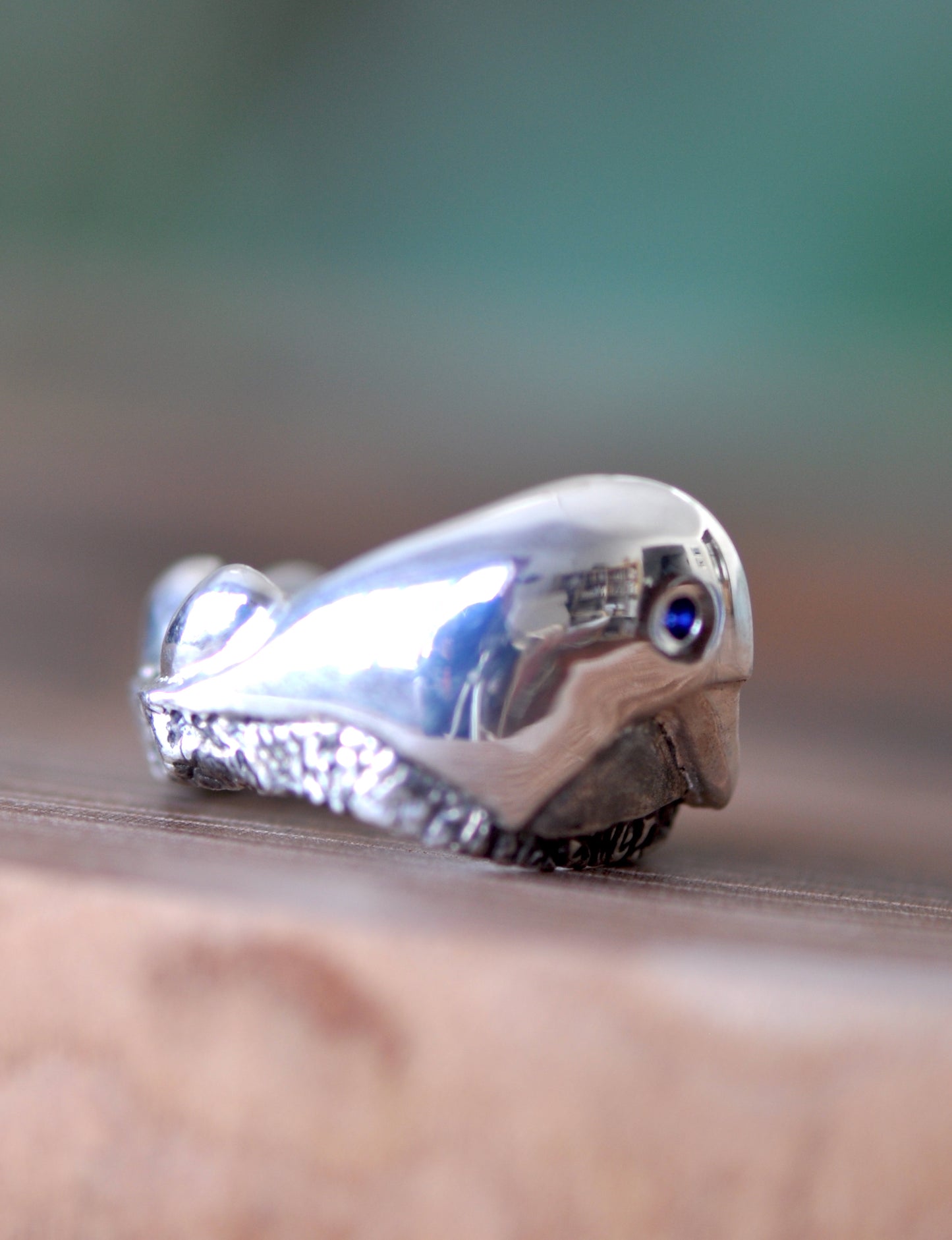 a close up of a silver object on a table