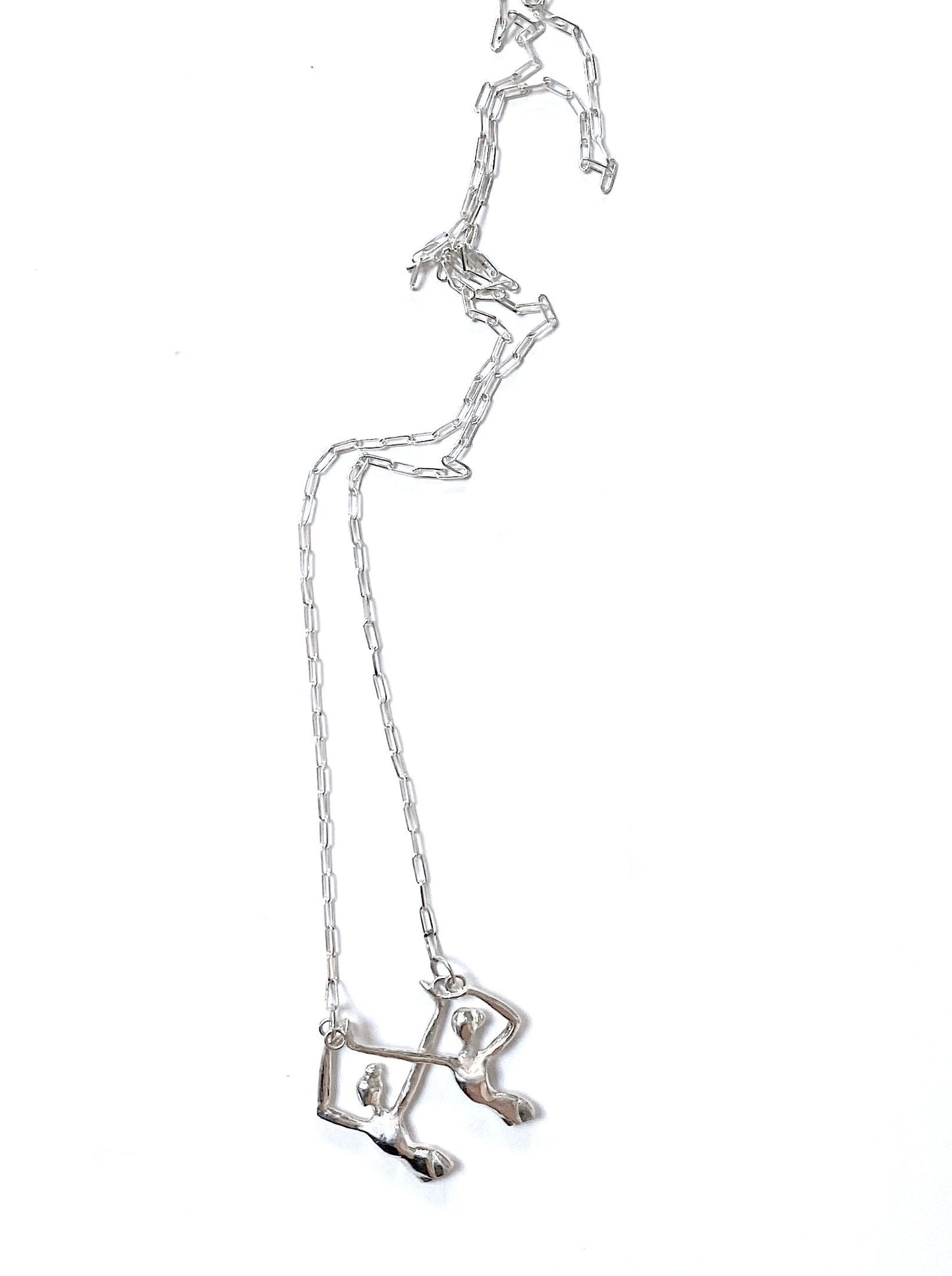 a silver necklace with a long metal chain