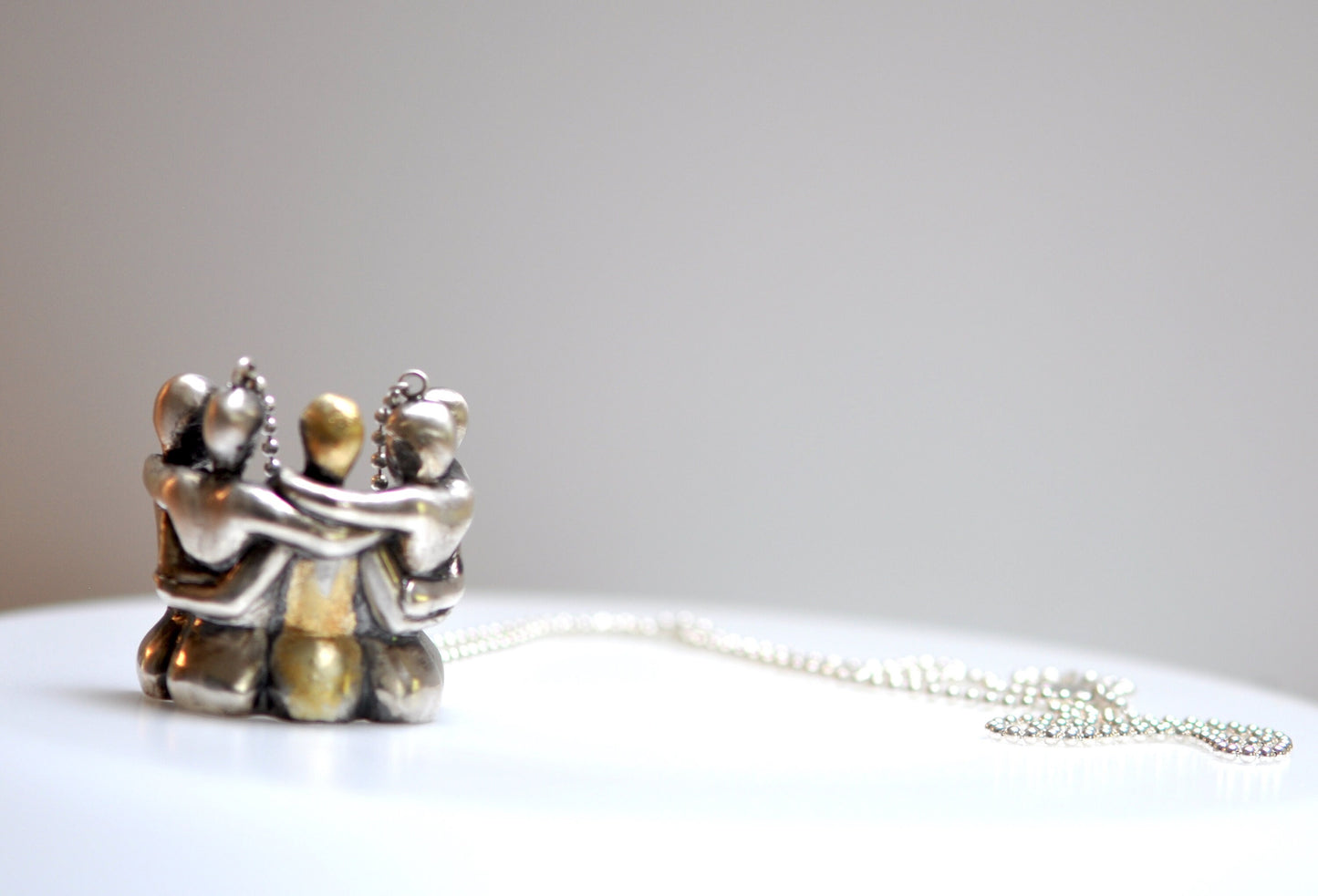 a couple of figurines sitting on top of a white table