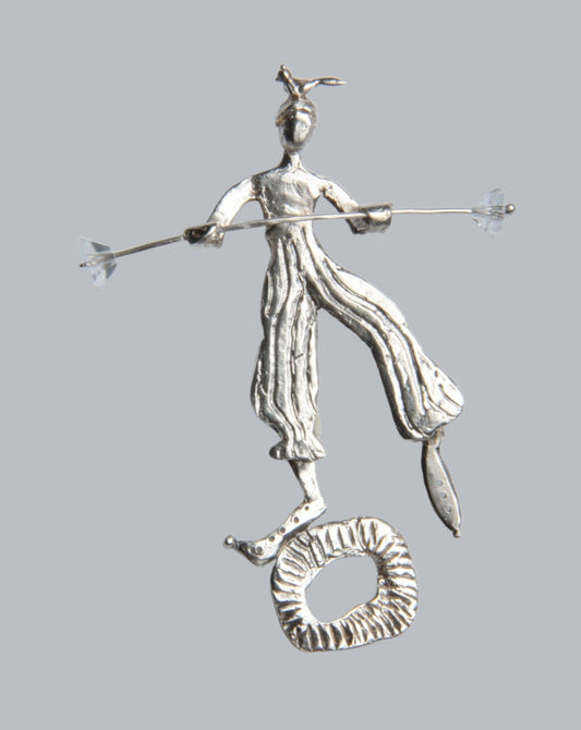 a silver figurine of a man holding a spear