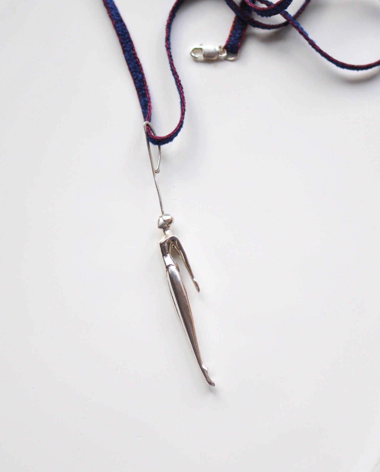 a close up of a pair of scissors on a cord