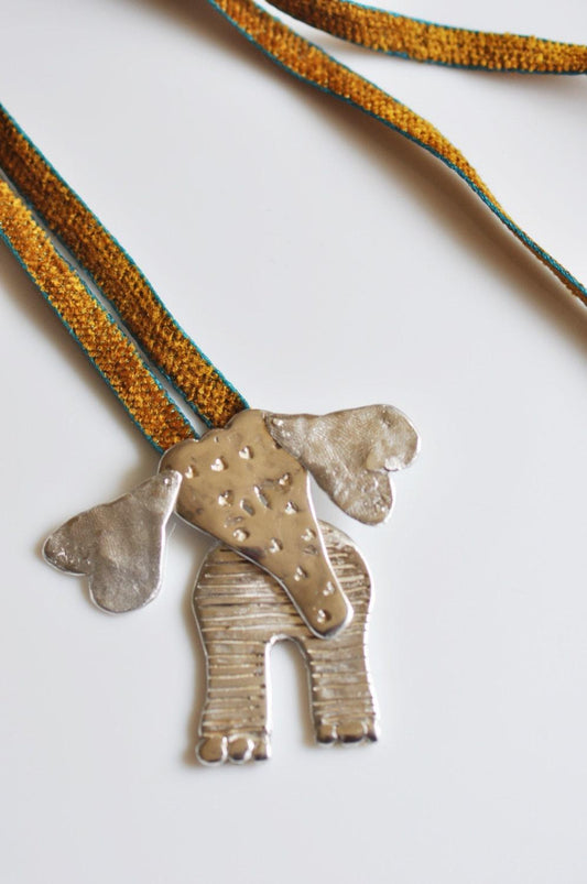 a necklace with a dog on it